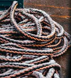 High angle view of rope tied on metal