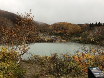 Scenic view of lake against sky during autumn