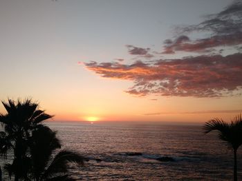 Scenic view of sea against sky at sunset