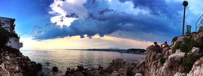 Scenic view of sea against cloudy sky