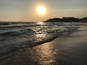 Scenic view of beach against sky during sunset