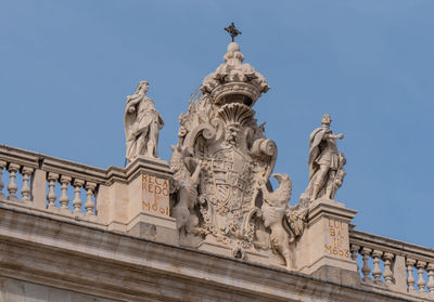 Low angle view of statue against sky