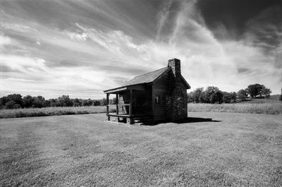 House on field against sky