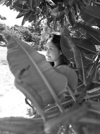 Close-up of girl with tree