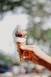 Hand holding ice cream cone