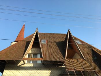 Low angle view of building against clear blue sky