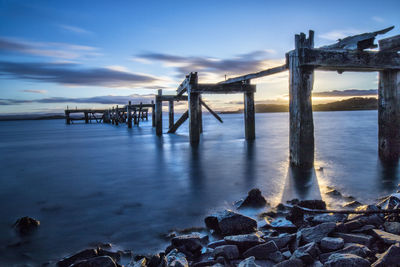 Pier over sea against sky