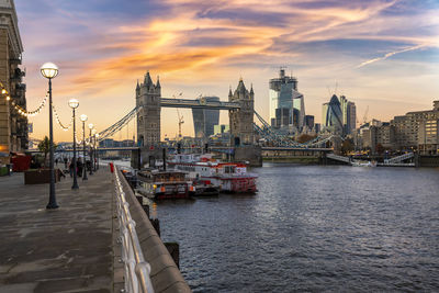 View of city at waterfront during sunset