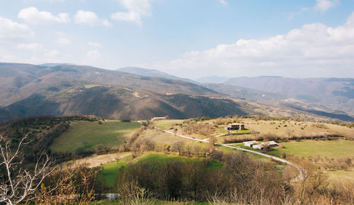 Scenic view of landscape against cloudy sky