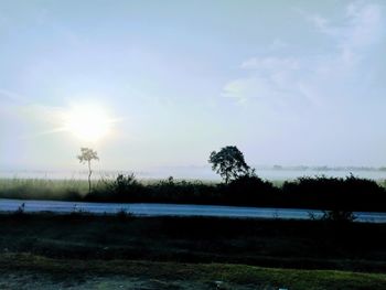 Scenic view of field against sky during sunset