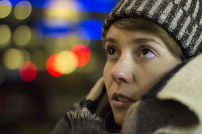 Close-up portrait of young woman in winter