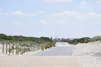 Road by sea against sky