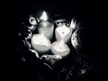 Close-up of illuminated christmas lights in darkroom