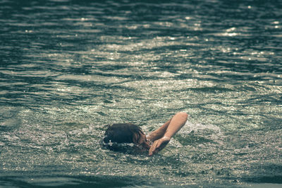 Young man swimming