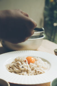 Cropped hand of person having food