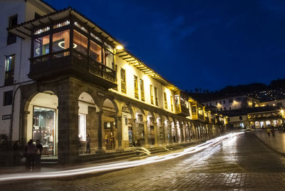 Illuminated buildings in city at night