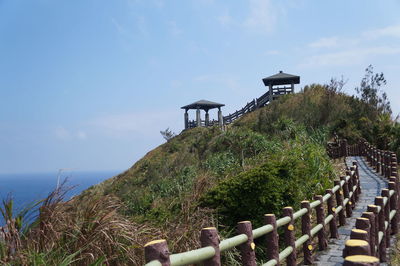 Lifeguard hut by sea against sky