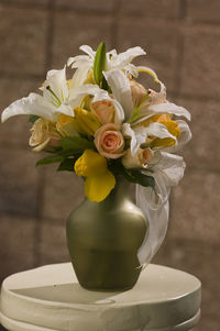 Close-up of white rose flower vase on table