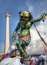 Low angle view of statue against sky