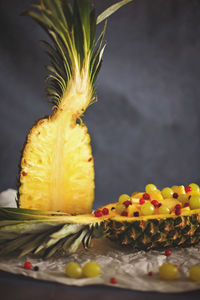 Close-up of cake on table against black background