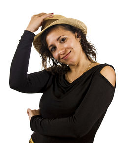 Portrait of smiling young woman against white background