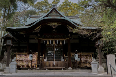 Entrance of temple against building