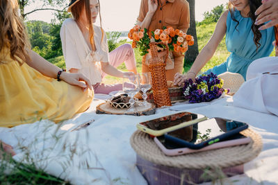 People enjoying picnic on field