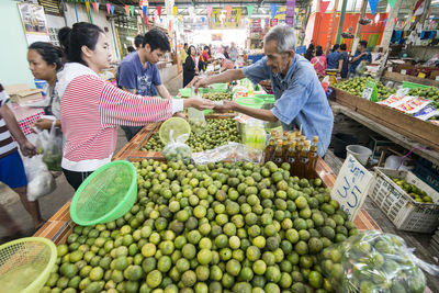 Group of people at market stall