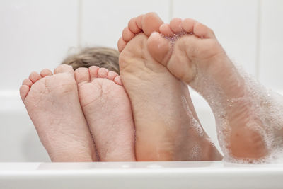 Close-up of hand holding baby feet