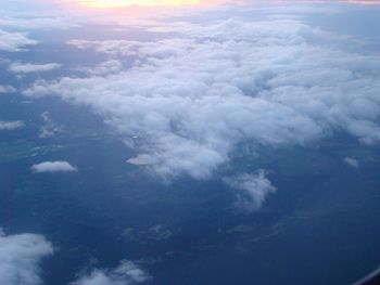 Aerial view of landscape against cloudy sky