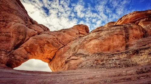 Scenic view of rock formation against cloudy sky