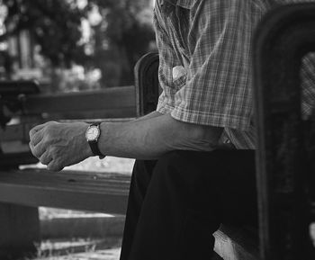 Side view of man standing against blurred background