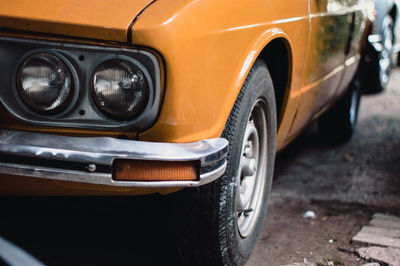 Close-up of vintage car on street