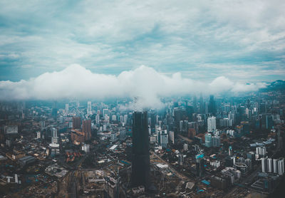 High angle view of modern buildings in city against sky in kuala lumpur, malaysia 