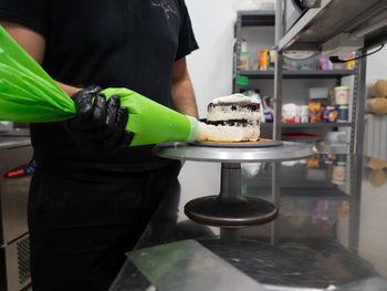 Midsection of man preparing food