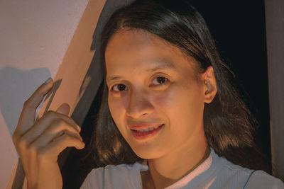 Close-up of young woman using mobile phone