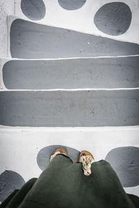 Low section of man standing on floor