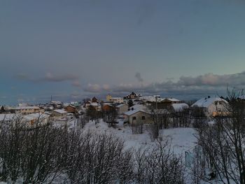 Buildings in city against sky