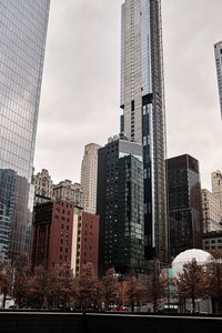 Low angle view of buildings against sky in city