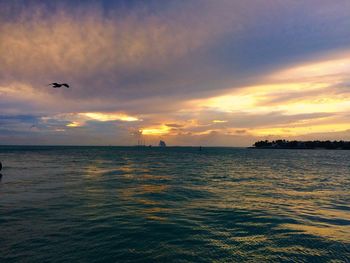 Scenic view of sea against cloudy sky