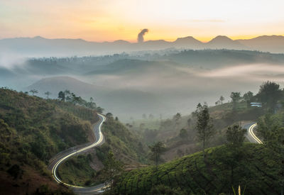 Scenic view of mountains against sky during sunset