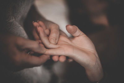 Close-up of woman holding hands