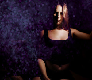 Midsection of woman wearing hat