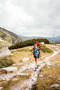 Rear view of man walking on mountain