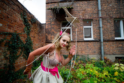 Rear view of young woman sitting on swing