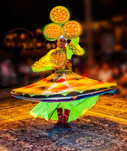 Man holding multi colored umbrella