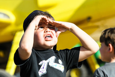 Close-up of boys looking away