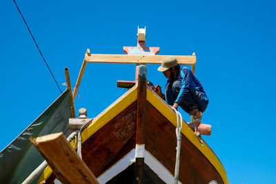 Low angle view of built structure against clear blue sky