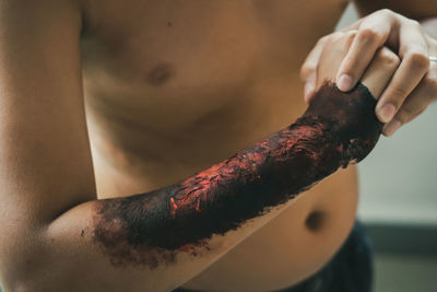 Close up of zombie hand with blood. horror and scary concept. thriller concept.