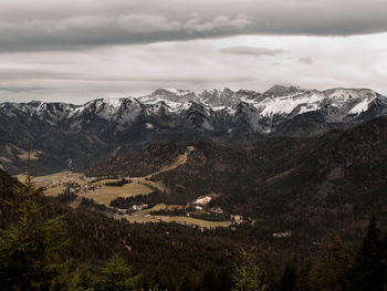 Scenic view of mountains against cloudy sky